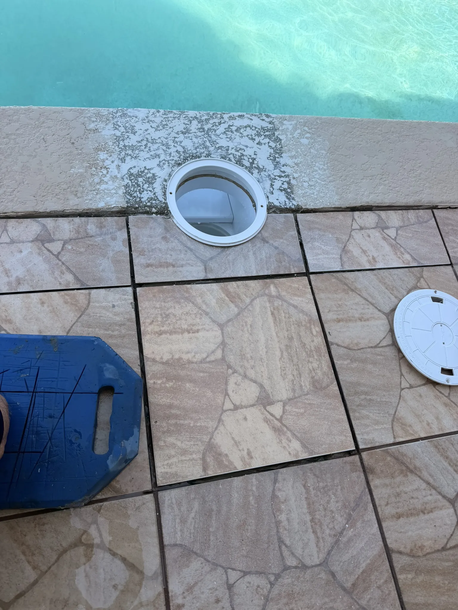 Water line and deck tile reset around the new skimmer — Daytona Beach, FL