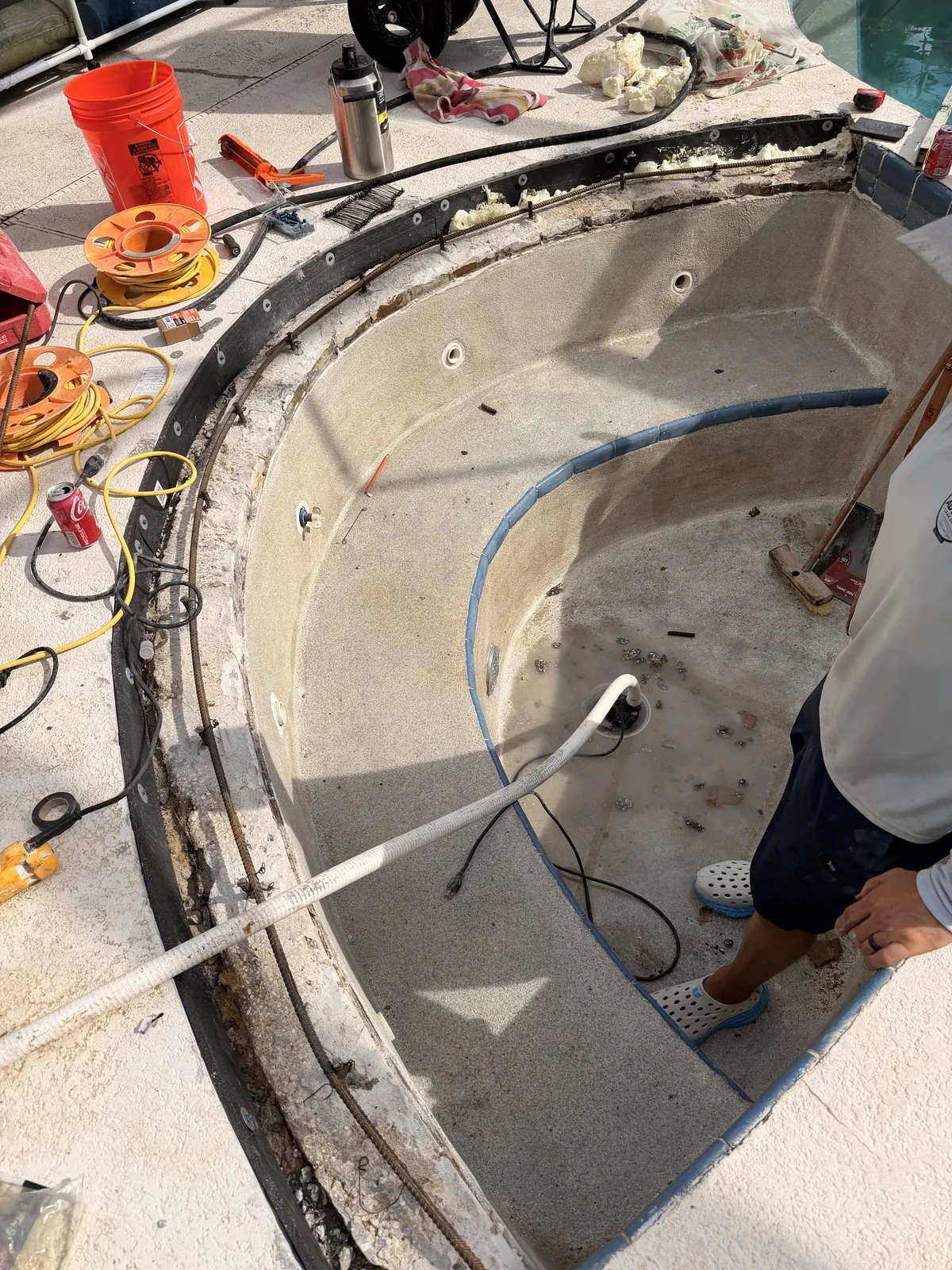 Rebar doweled into the spa shell and tied to a continuous horizontal bar along the beam — Deltona, FL