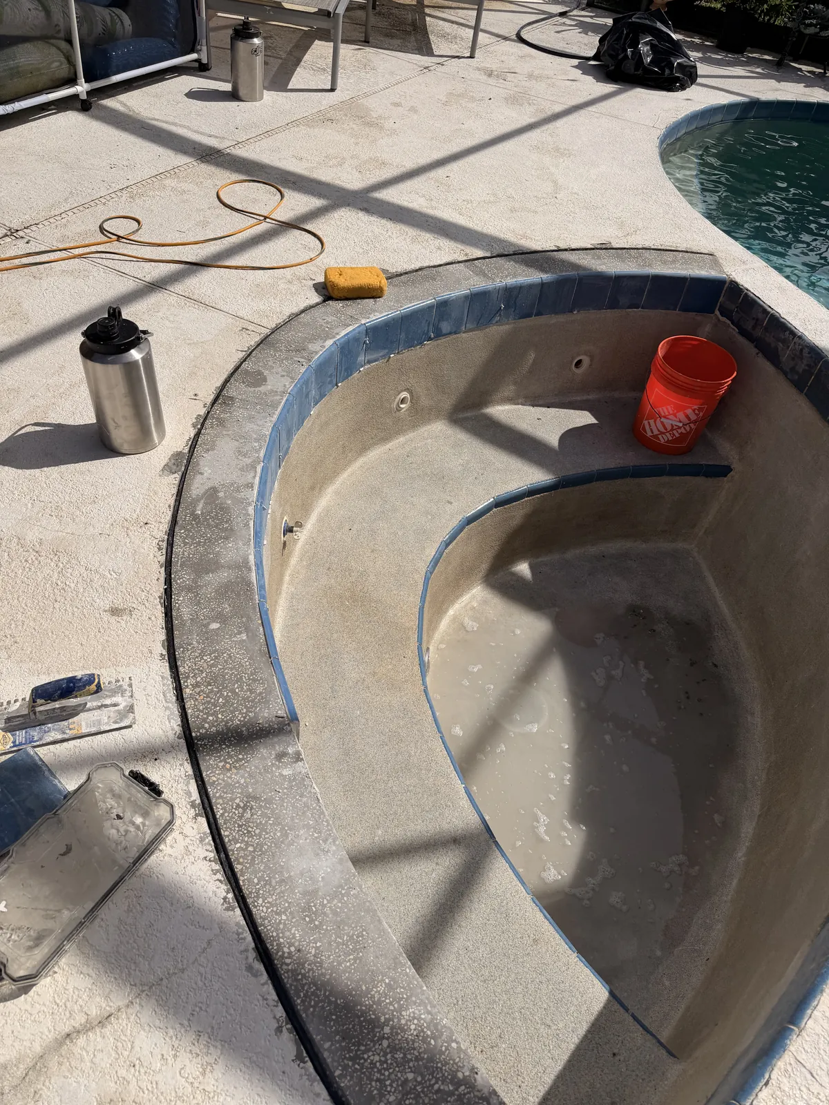 Spa tile line reset on the new concrete bond beam — Deltona, FL