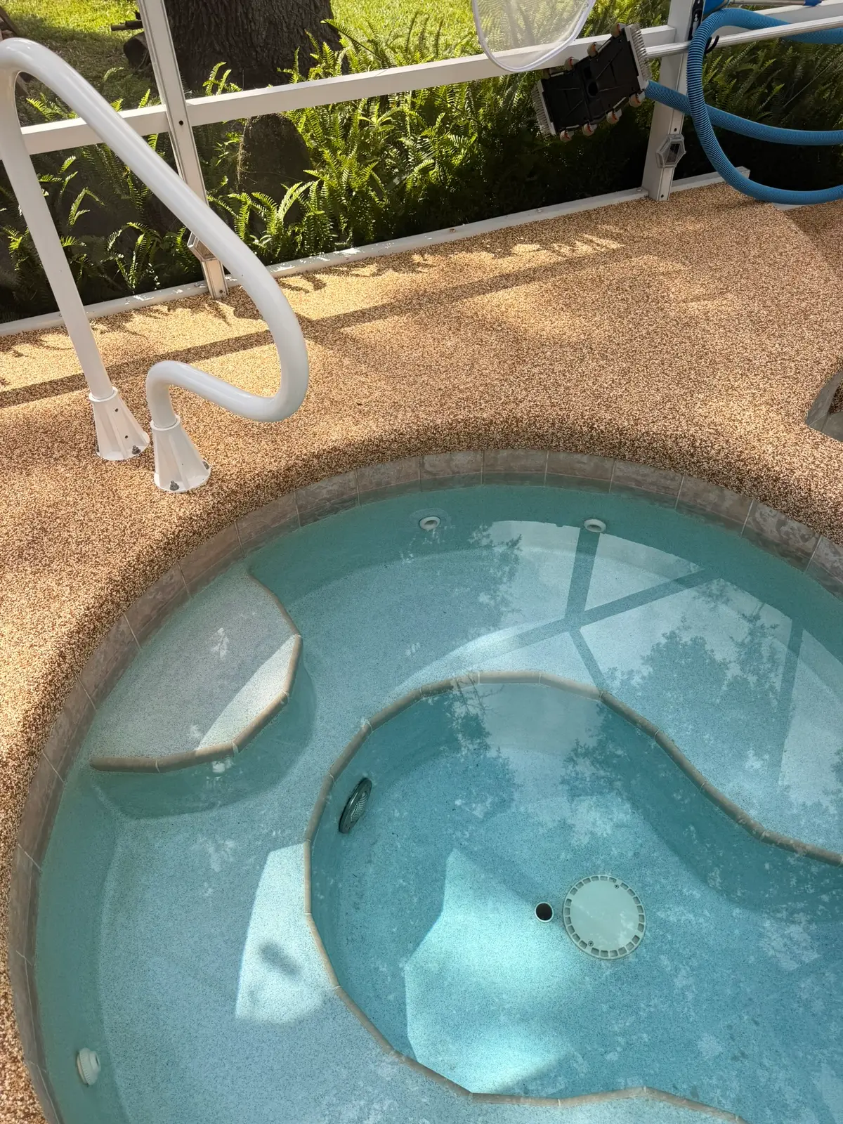 Finished spa refilled with the rubberized deck coating repaired around the patch — New Smyrna Beach, FL