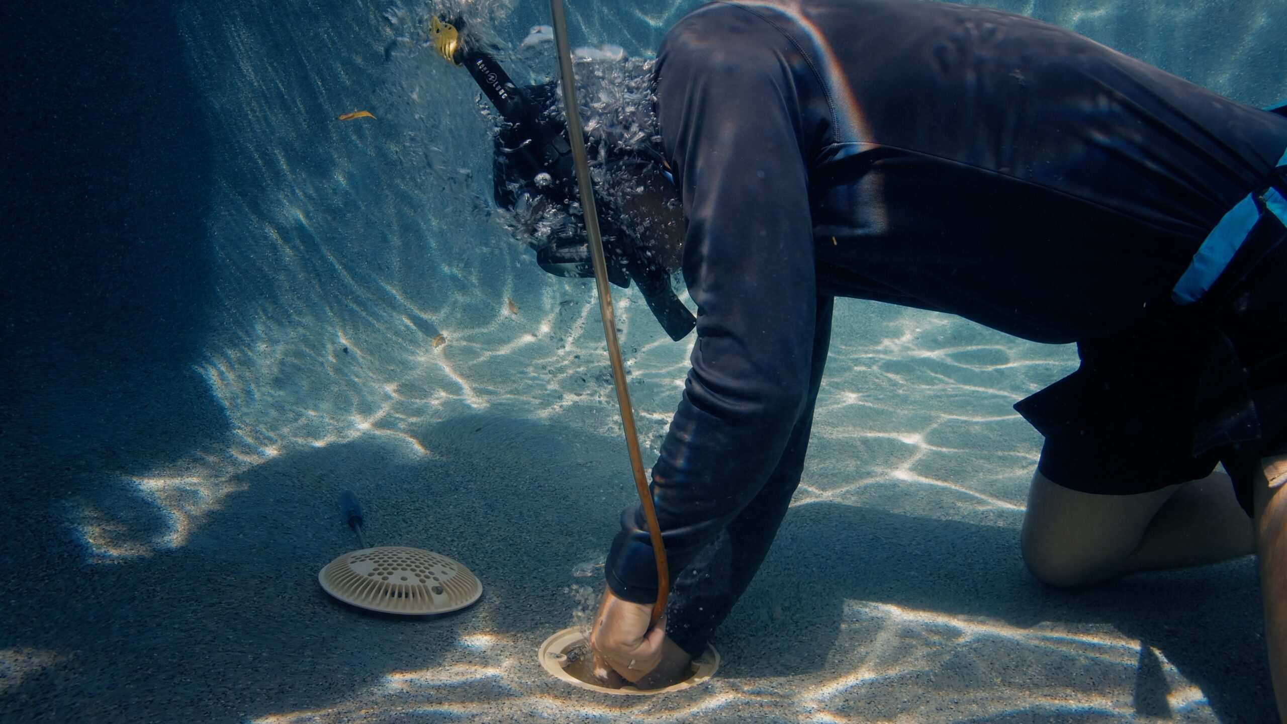 Underwater diver performing leak inspection